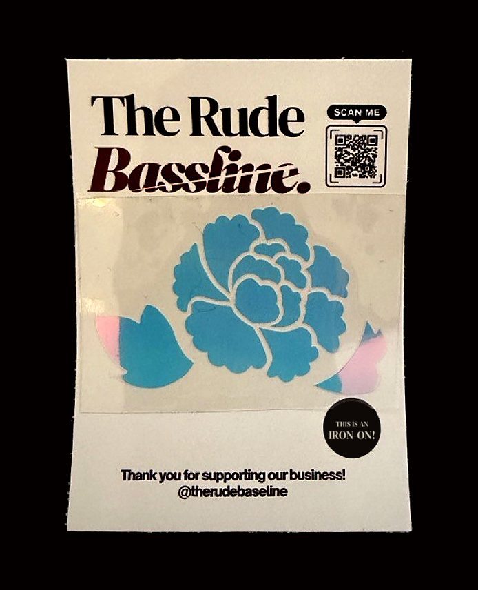A blue holographic peony on a Rude Bassline backing card